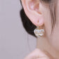 Boucles d'oreilles élégantes en or pour femmes, ornées de pierres précieuses et de cristaux