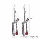 Boucles d’Oreilles Longues Pendantes en Forme de Squelette Articulé