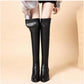 Bottes noires au-dessus du genou avec talon